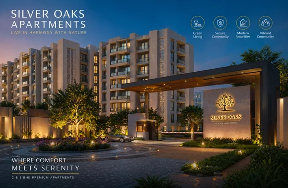 Grand entrance of Silver Oaks Residential Apartments in Islamabad featuring modern residential buildings, landscaped driveway, illuminated gate, and premium apartment community amenities at dusk.